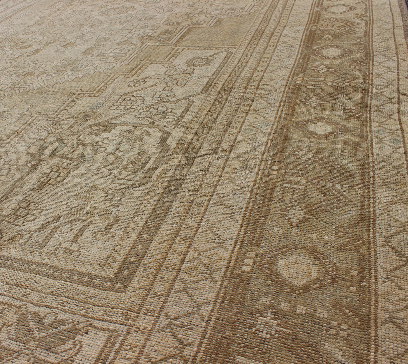 Large Vintage Turkish Floral Medallion Oushak Rug in All Neutral Palette Measures: 7'3 x 13' This muted Turkish Oushak features a light khaki border and background with shades of beige. The corners and central medallion are composed of a... - Keivan Woven ArtsTU - MTU - 95085 - 3692Rug