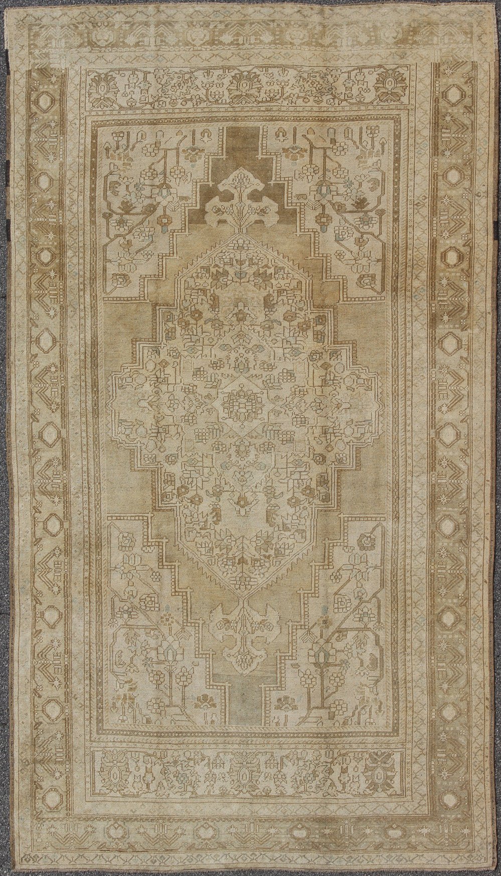 Large Vintage Turkish Floral Medallion Oushak Rug in All Neutral Palette Measures: 7'3 x 13' This muted Turkish Oushak features a light khaki border and background with shades of beige. The corners and central medallion are composed of a... - Keivan Woven ArtsTU - MTU - 95085 - 3692Rug