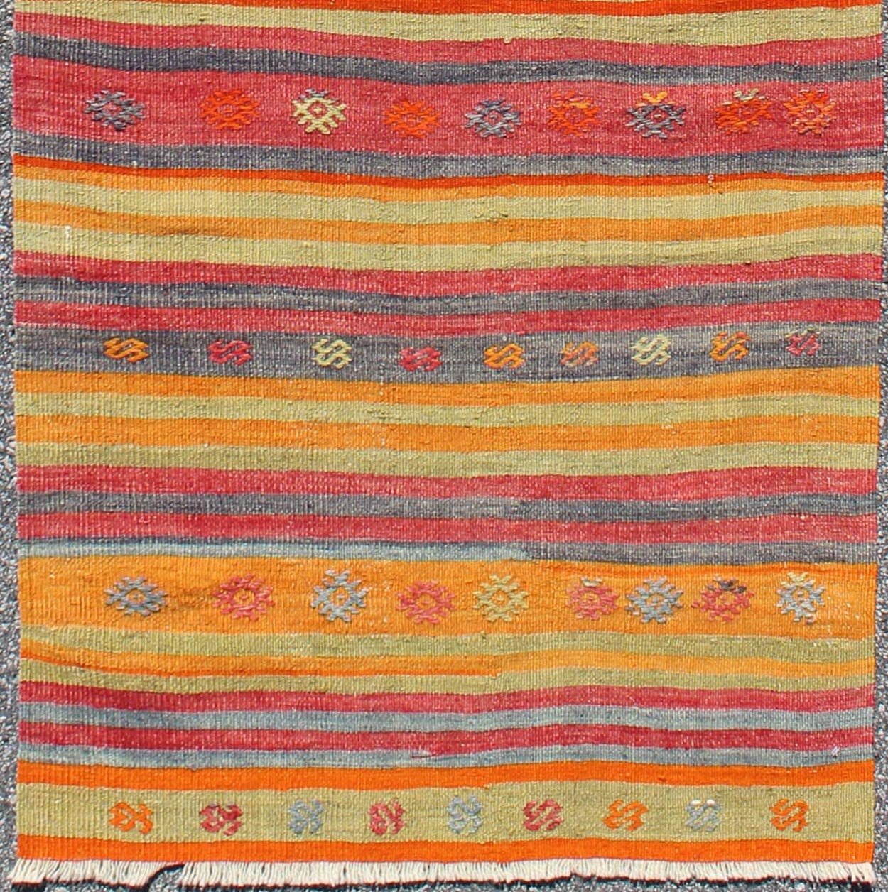 Vintage Turkish Kilim Runner With Geometric Tribal Designs and Colorful Stripes. Keivan Woven Arts / rug TU - NED - 119, country of origin / type: Turkey / Kilim, circa mid - 20th century Measures: 2'10 x 9'2. Featuring tribal shapes rendered in a repe... - Keivan Woven ArtsTU - NED - 119 - 3544Rug
