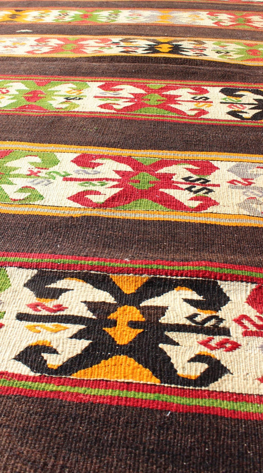 Keivan Woven Arts - Vintage Turkish Kilim rug with Vivid colors and tribal stripes on charcoal background, rug TU - NED - 132, country of origin / type: Turkey / Kilim, circa mid - 20th century. Featuring tribal elements rendered in a repeating horizon... - Keivan Woven ArtsTU - NED - 132 - 3576