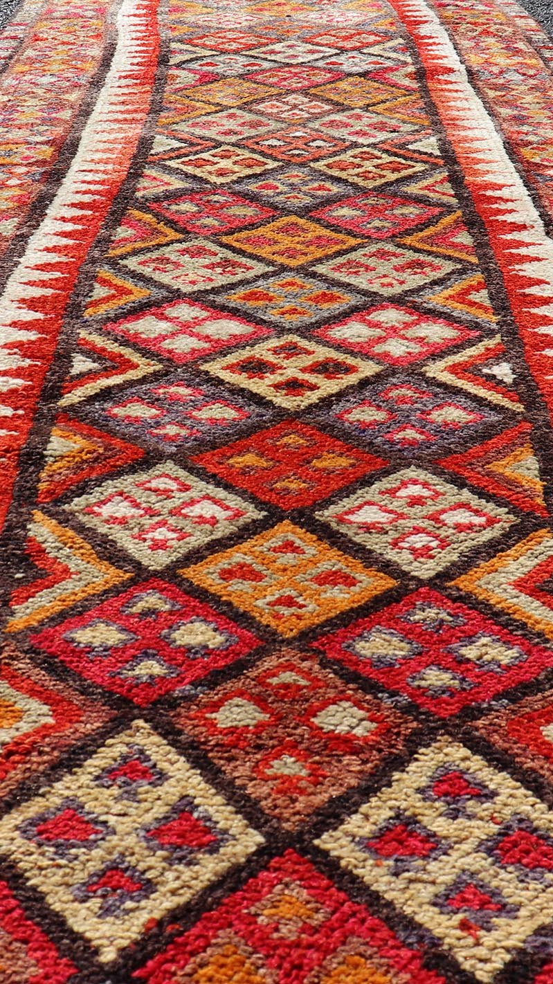 Measures: 2'9 x 9'10 Multicolored Midcentury Turkish Kurdish Oushak Runner with Diamonds and Stars. Keivan Woven Arts / rug TU - NED - 4692, country of origin / type: Iran / Kurdish Oushak, circa 1950 This Kurdish tribal rug was woven by Kurdish wea... - Keivan Woven ArtsTU - NED - 4692 - 22129Rug