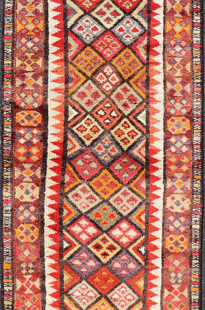 Measures: 2'9 x 9'10 Multicolored Midcentury Turkish Kurdish Oushak Runner with Diamonds and Stars. Keivan Woven Arts / rug TU - NED - 4692, country of origin / type: Iran / Kurdish Oushak, circa 1950 This Kurdish tribal rug was woven by Kurdish wea... - Keivan Woven ArtsTU - NED - 4692 - 22129Rug