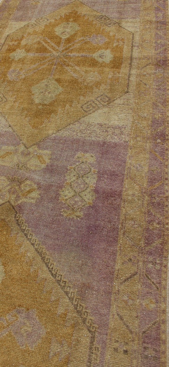 Purple and gold - toned Antique Oushak Runner from Turkey with Medallion Design, rug tu - sim - 03, country of origin / type: Turkey / Oushak, circa 1920 This beautiful vintage Oushak runner from 1920s Turkey features a Classic Oushak design, which is... - Keivan Woven ArtsTU - SIM - 03 - 2418Rug
