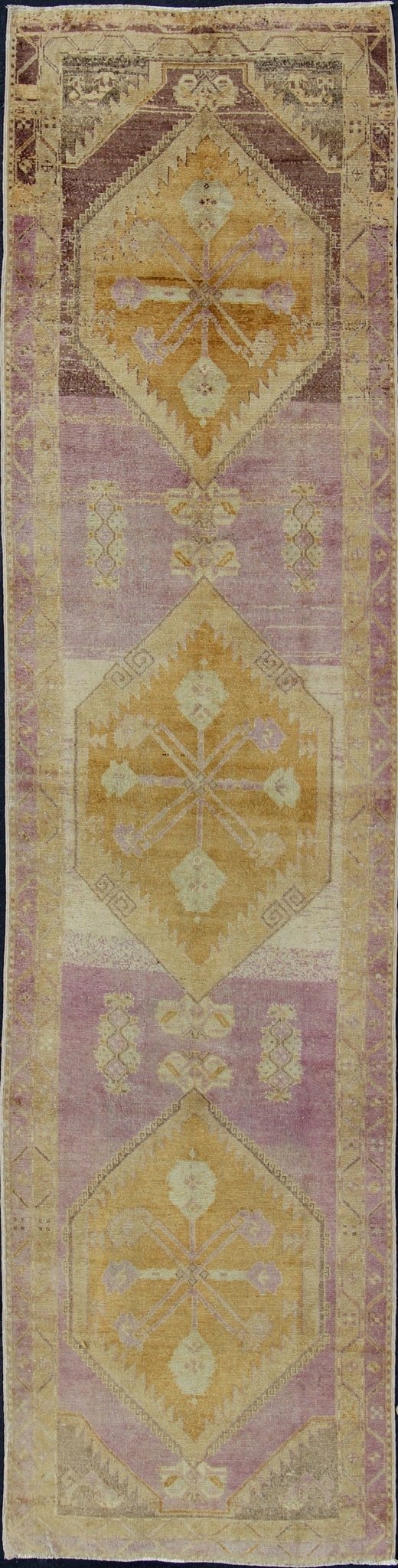 Purple and gold - toned Antique Oushak Runner from Turkey with Medallion Design, rug tu - sim - 03, country of origin / type: Turkey / Oushak, circa 1920 This beautiful vintage Oushak runner from 1920s Turkey features a Classic Oushak design, which is... - Keivan Woven ArtsTU - SIM - 03 - 2418Rug