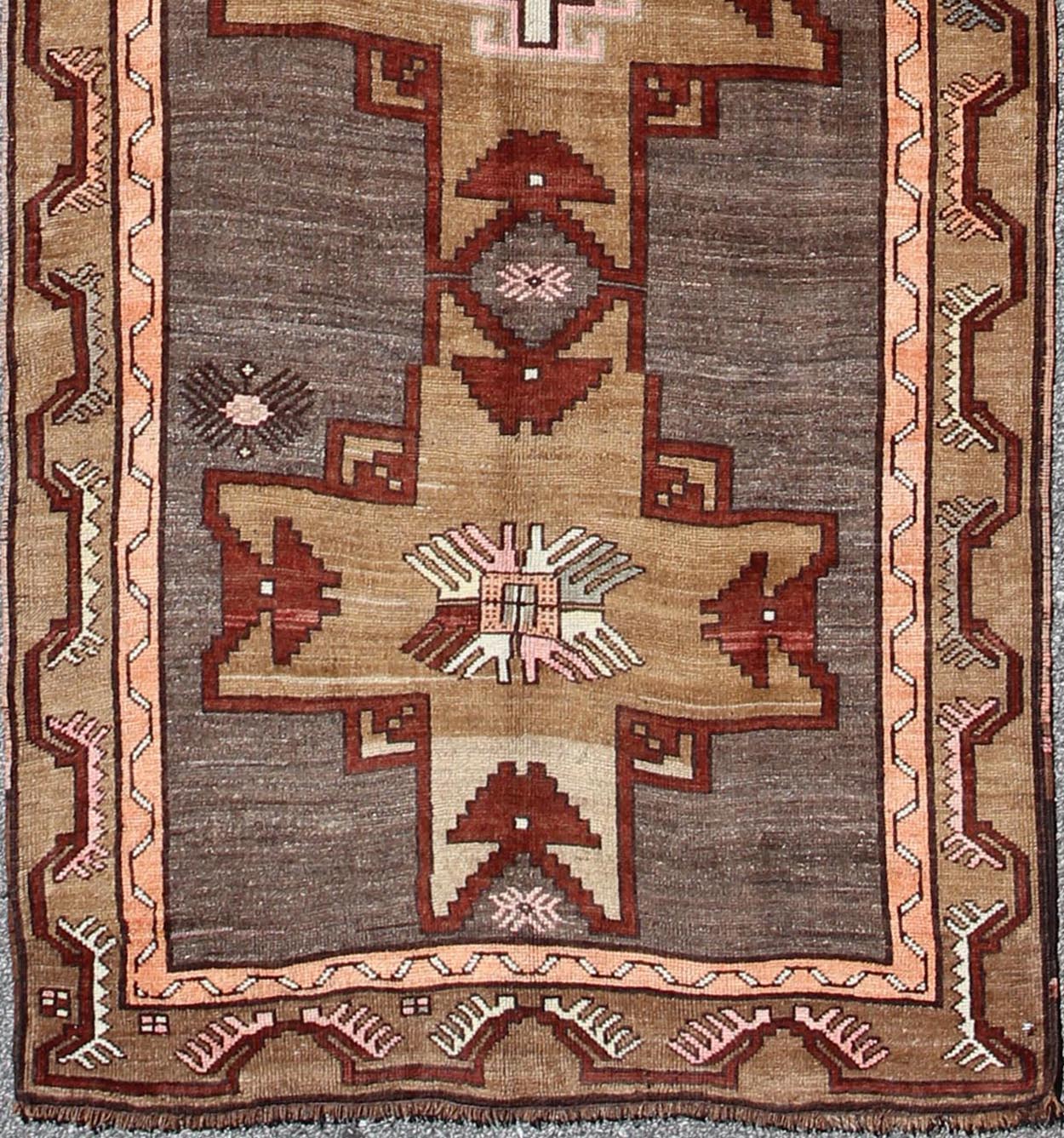 Vintage Turkish Carpet with Vertical Cross Shapes and Geometric Elements Vintage Turkish Carpet with Vertical Cross Shapes and Geometric Elements rug/tu - sim - 25 origin/ turkey kwarugs This vintage Turkish rug features a unique blend of col... - Keivan Woven ArtsTU - SIM - 25 - 3910Rug