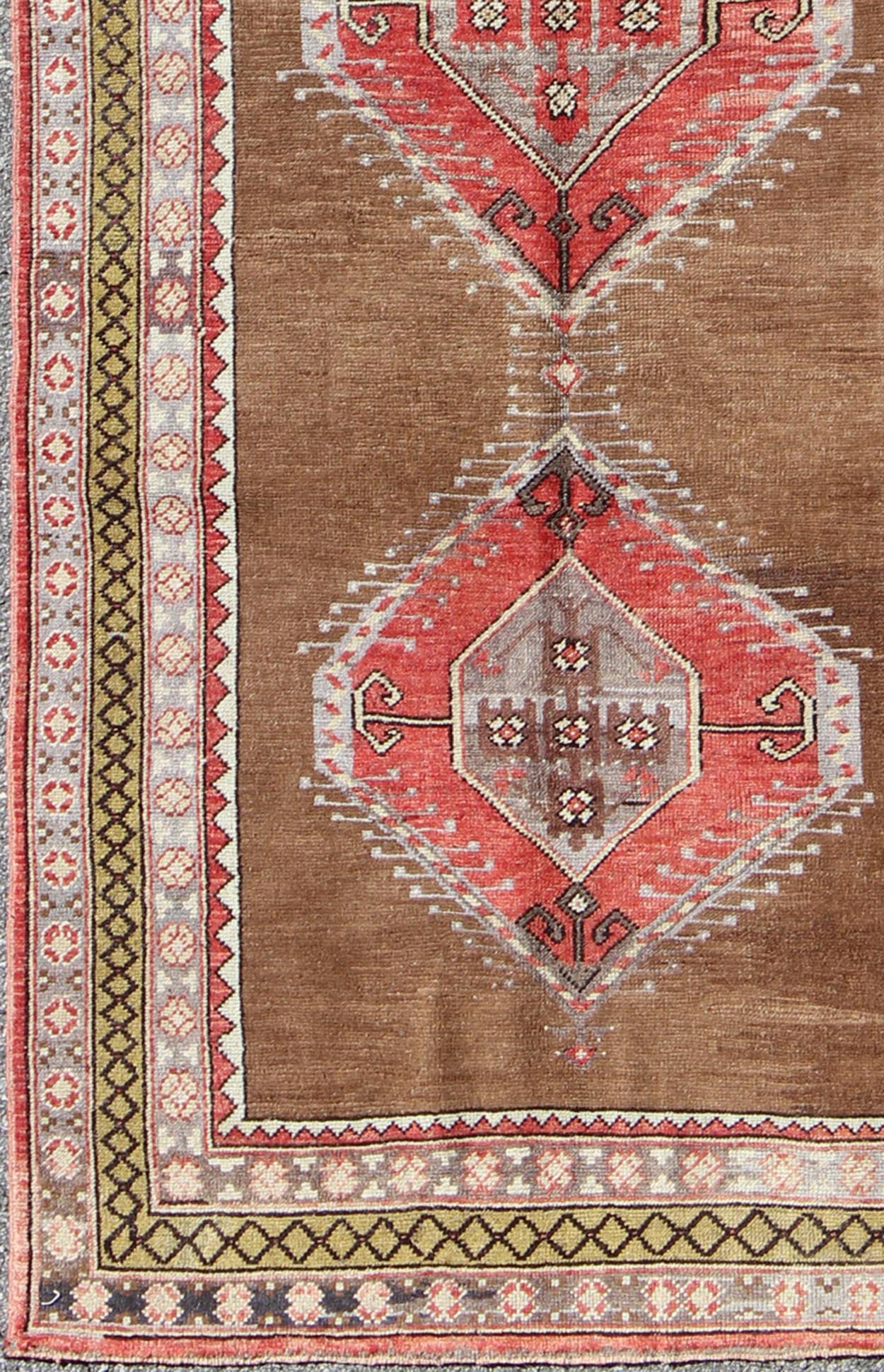 Vintage Turkish Oushak Rug with Three Large Medallions and Multiple Borders This beautiful vintage Oushak runner from mid - 20th century Turkey features a Classic Oushak design, which is enhanced by its lustrous wool. The faint brown ground is hom... - Keivan Woven ArtsTU - TRS - 3432 - 5920Rug