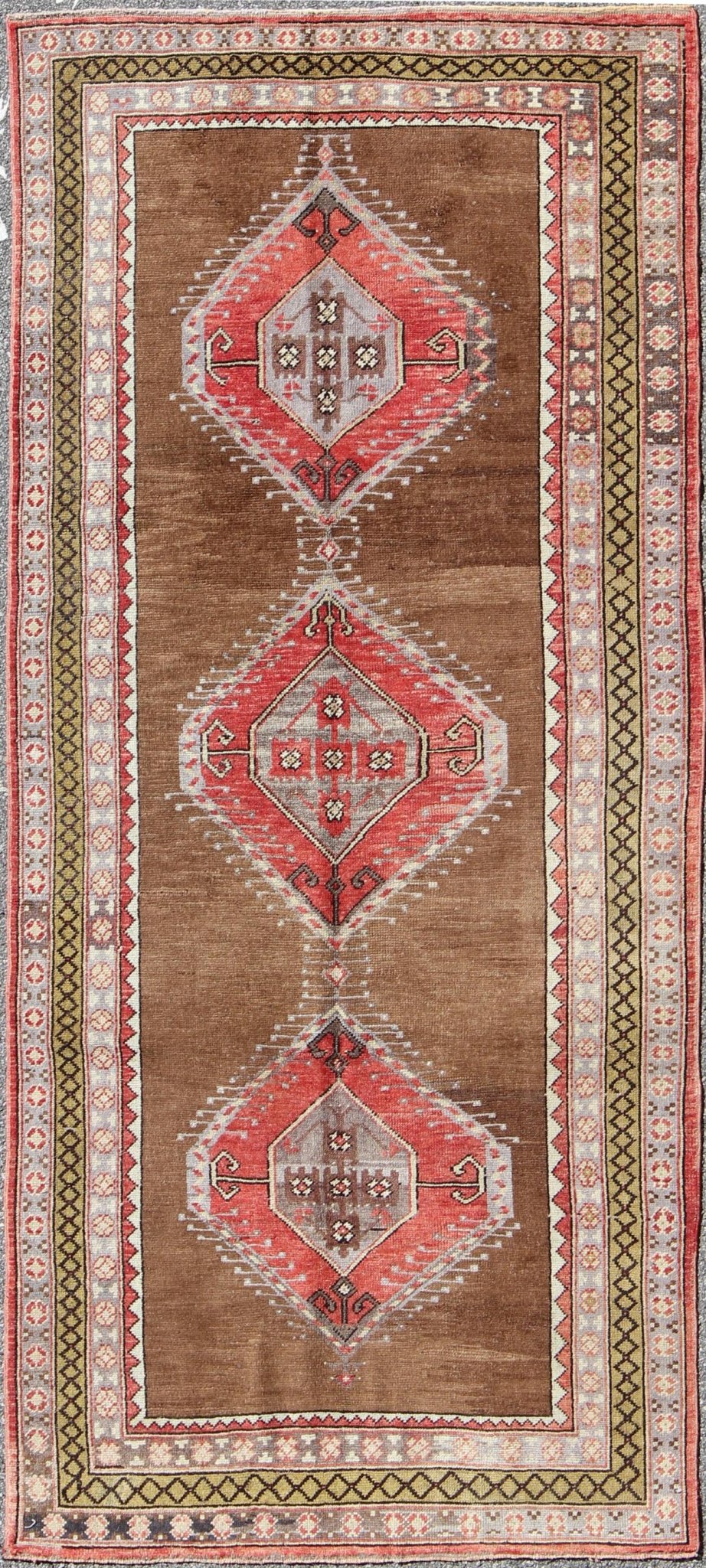Vintage Turkish Oushak Rug with Three Large Medallions and Multiple Borders This beautiful vintage Oushak runner from mid - 20th century Turkey features a Classic Oushak design, which is enhanced by its lustrous wool. The faint brown ground is hom... - Keivan Woven ArtsTU - TRS - 3432 - 5920Rug