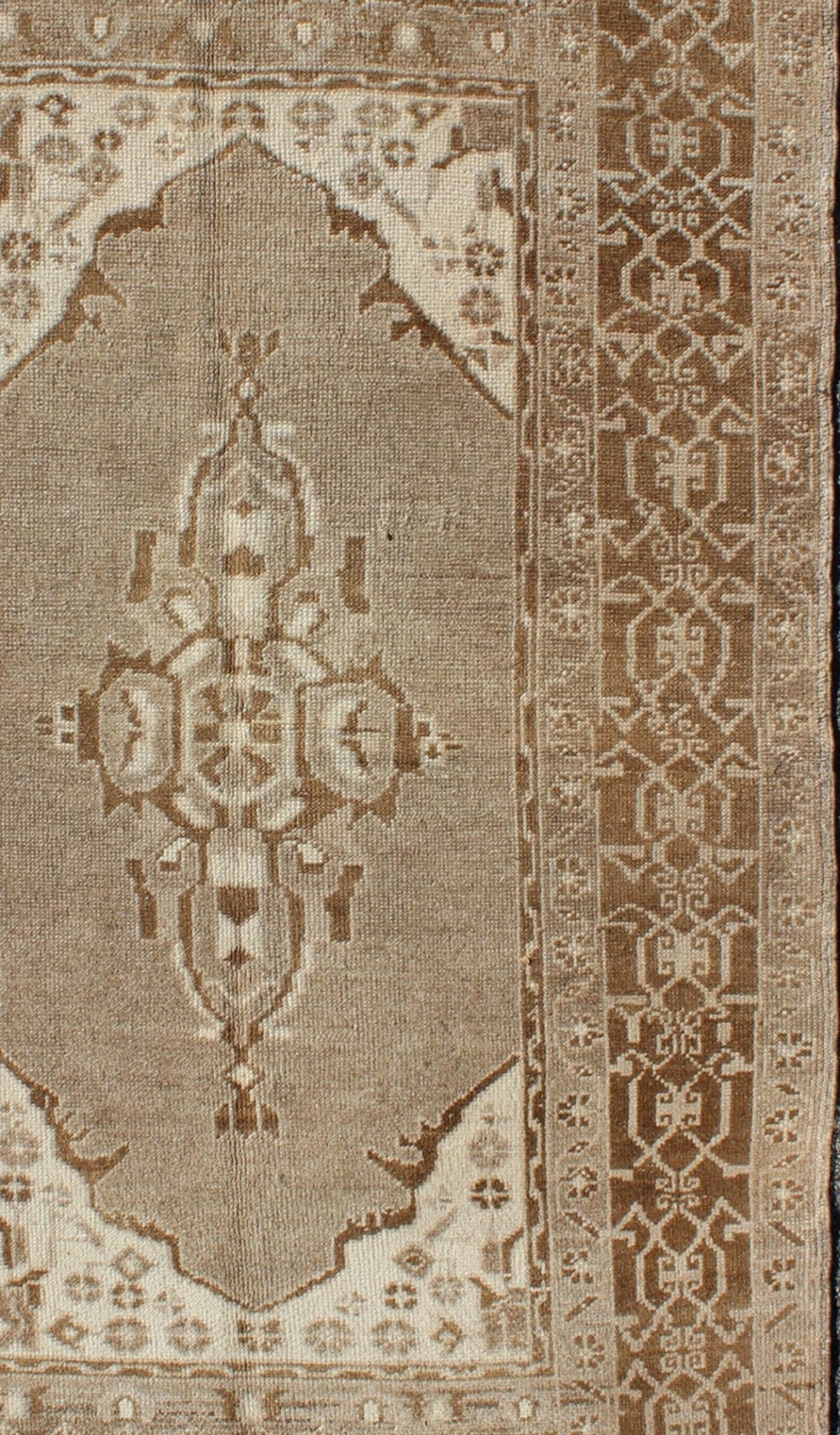 Vintage Turkish Medallion Oushak Area Rug in Grey and Brown's Measures: 3.10 x 6.10 Set amidst a taupe and gray background and featuring a gentle medallion, the beautiful and delicate design of this rug is framed by repeating geometric el... - Keivan Woven ArtsTU - TRS - 95020 - 3582Rug