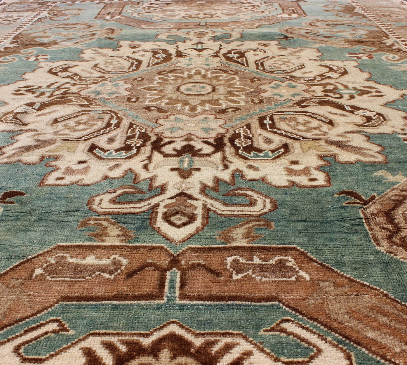 Vintage Hand Knotted Turkish Carpet With Geometric Tribal Medallion Design Geometric design rug in brown, turquoise, taupe, and ivory, Keivan Woven Arts / rug tu - ugu - 3402, country of origin / type: Turkey / Oushak, circa 1940 Set on a uni... - Keivan Woven ArtsTU - UGU - 3402 - 5906Rug