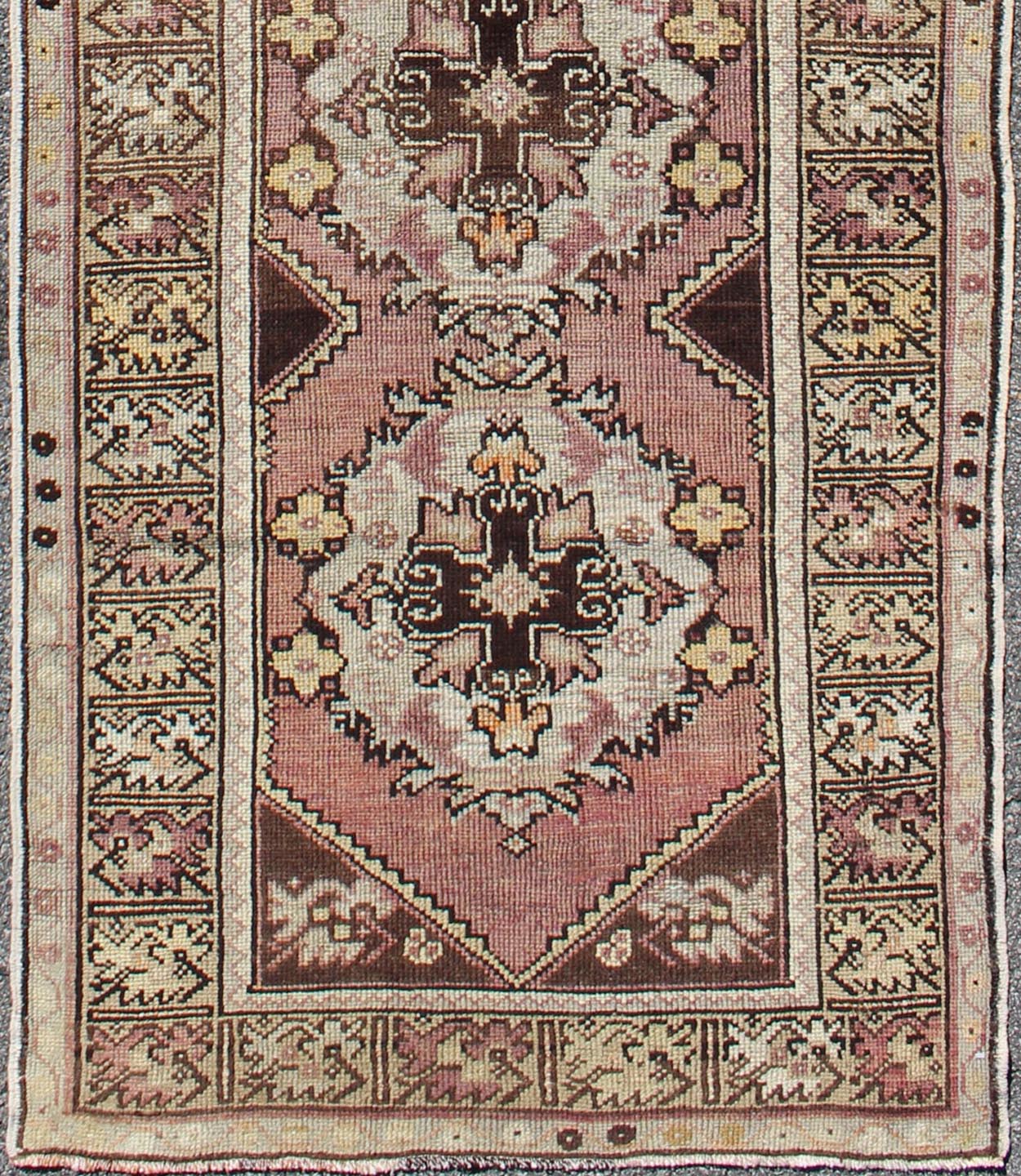 Vintage Turkish Oushak Runner with Floral Medallions in Brown Lavender and Taupe Measures: 2'11'' x 9'8''. This beautiful vintage Oushak runner from 1940s Turkey features a Classic Oushak design. The reddish - colored ground is home to intercon... - Keivan Woven ArtsTU - UGU - 3482 - 6933Rug