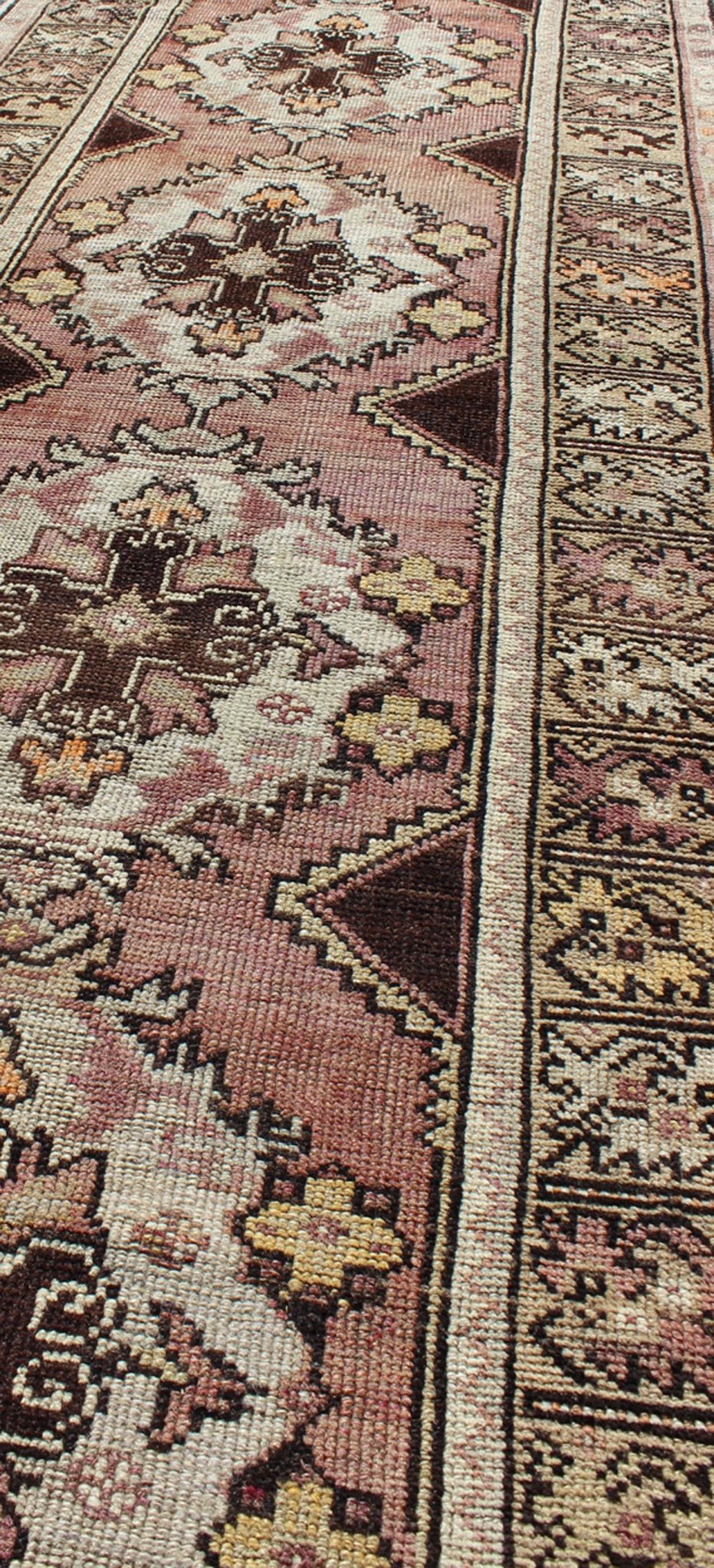 Vintage Turkish Oushak Runner with Floral Medallions in Brown Lavender and Taupe Measures: 2'11'' x 9'8''. This beautiful vintage Oushak runner from 1940s Turkey features a Classic Oushak design. The reddish - colored ground is home to intercon... - Keivan Woven ArtsTU - UGU - 3482 - 6933Rug