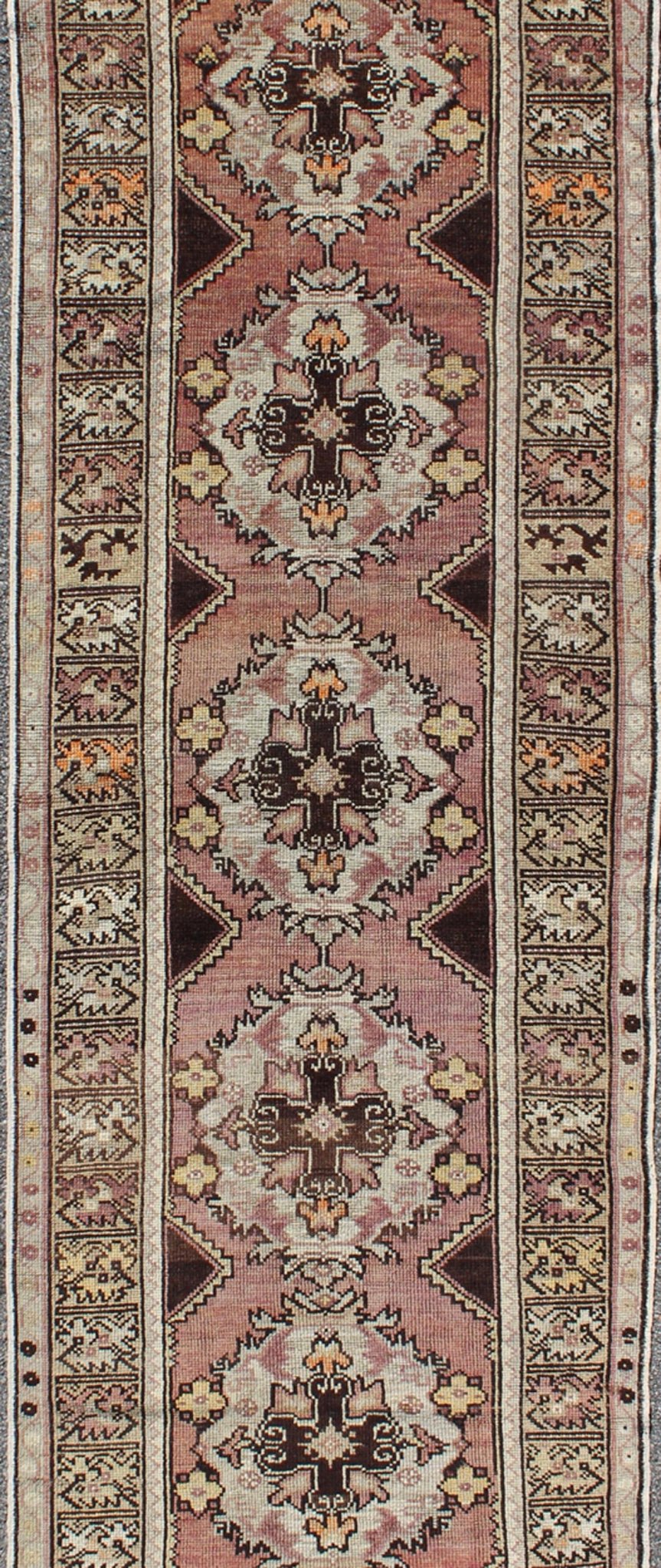 Vintage Turkish Oushak Runner with Floral Medallions in Brown Lavender and Taupe Measures: 2'11'' x 9'8''. This beautiful vintage Oushak runner from 1940s Turkey features a Classic Oushak design. The reddish - colored ground is home to intercon... - Keivan Woven ArtsTU - UGU - 3482 - 6933Rug