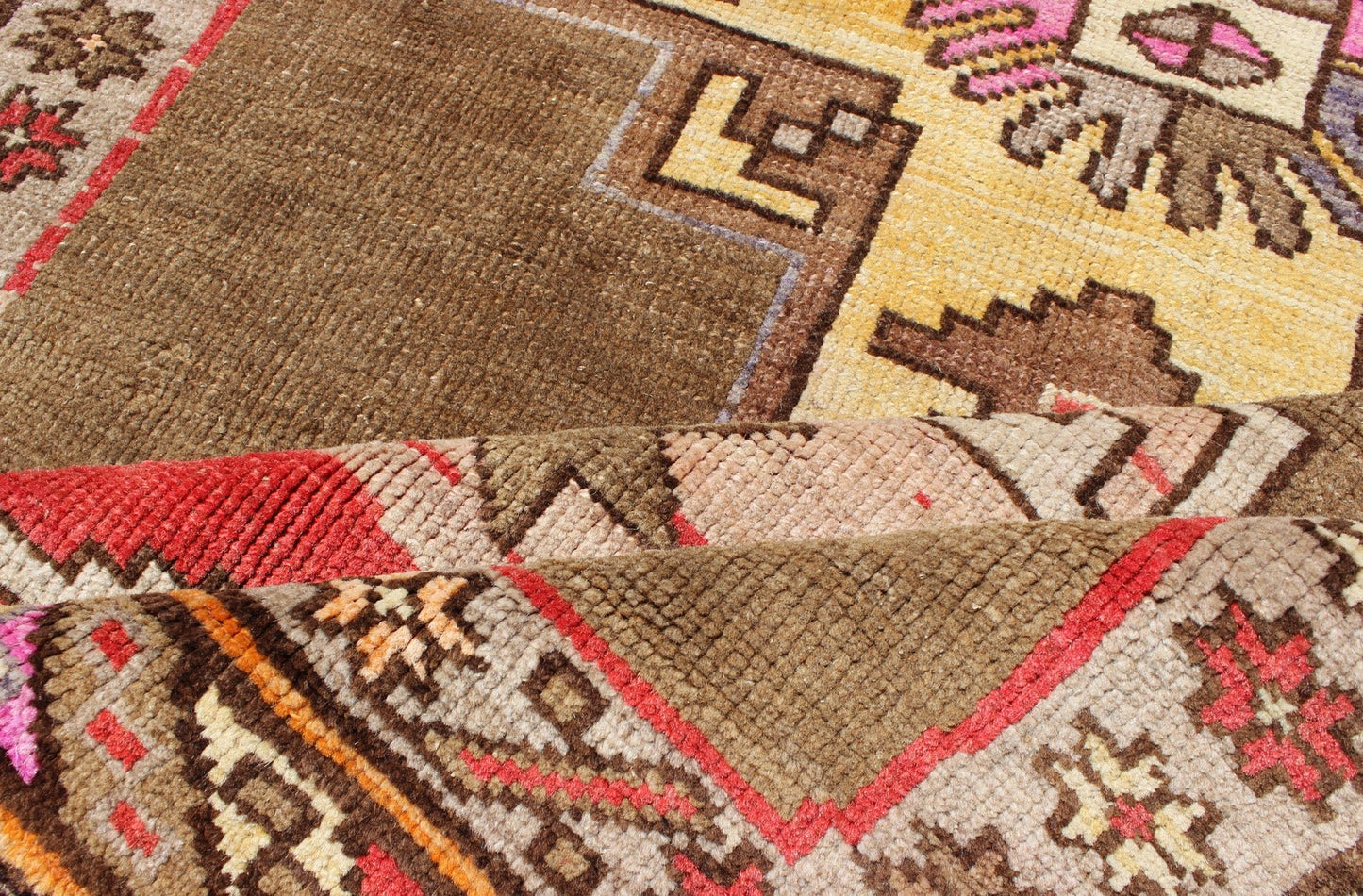 Unique & Colorful Turkish Kars Runner with Tribal Designs and Geometric Motifs Vintage Turkish runner in greenish Brown background, ivory border with accent colors, red, pink, tan, green, bright yellow, taupe, rug/TU - UGU - 4806, country of origin... - Keivan Woven ArtsTU - UGU - 4806 - 10287Rug