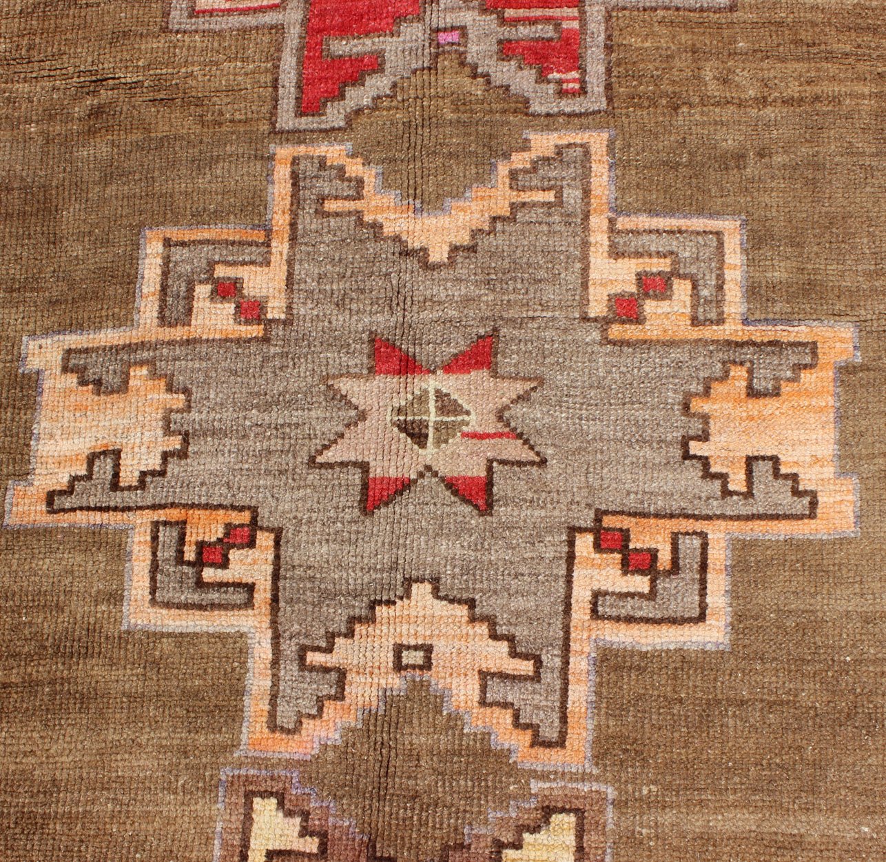Unique & Colorful Turkish Kars Runner with Tribal Designs and Geometric Motifs Vintage Turkish runner in greenish Brown background, ivory border with accent colors, red, pink, tan, green, bright yellow, taupe, rug/TU - UGU - 4806, country of origin... - Keivan Woven ArtsTU - UGU - 4806 - 10287Rug