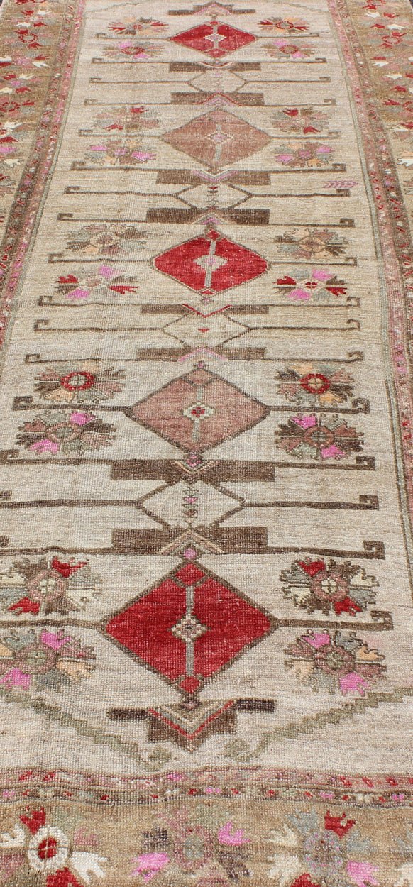 Vintage Unique Oushak Runner with Tribal Designs and Geometric Motifs kwarugs Vintage Turkish runner in red, pink, beige, tan, green, bright lavender, taupe, rug tu - ugu - 4809, country of origin / type: Turkey / Oushak, circa 1950 This... - Keivan Woven ArtsTU - UGU - 4809 - 10301Rug