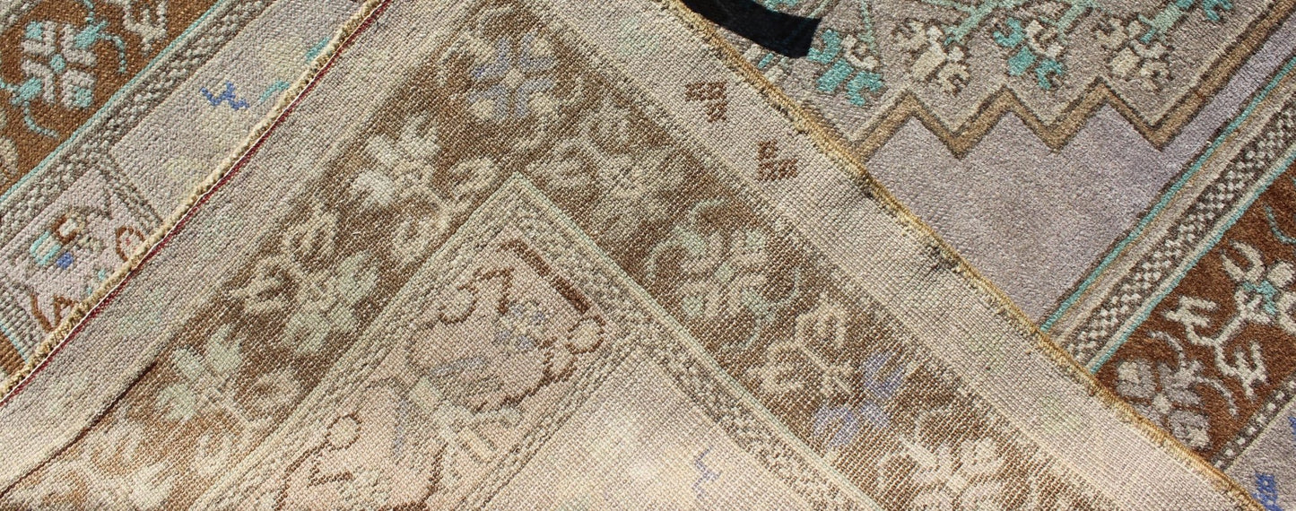 Vintage Oushak Rug in Light Lavender Background and Chocolate Brown Border. Vintage Oushak rug with central medallion in Light lavender, Taupe, Khaki, Teal green, blue accent colors and chocolate brown border. Keivan Woven Arts Rug TU - VEY - 3287,... - Keivan Woven ArtsTU - VEY - 3287 - 5910Rug