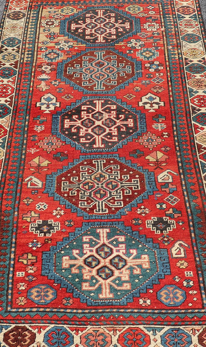 Antique Hand Knotted Caucasian Kazak Rug in Brilliant Red with Geometric Design Tribal geometric medallion design Kazak antique rug, antique Caucasian from Caucasus Region with a beautiful red background in multi - colors, Keivan Woven Arts rug V2... - Keivan Woven ArtsV21 - 0502 - 16394Rug
