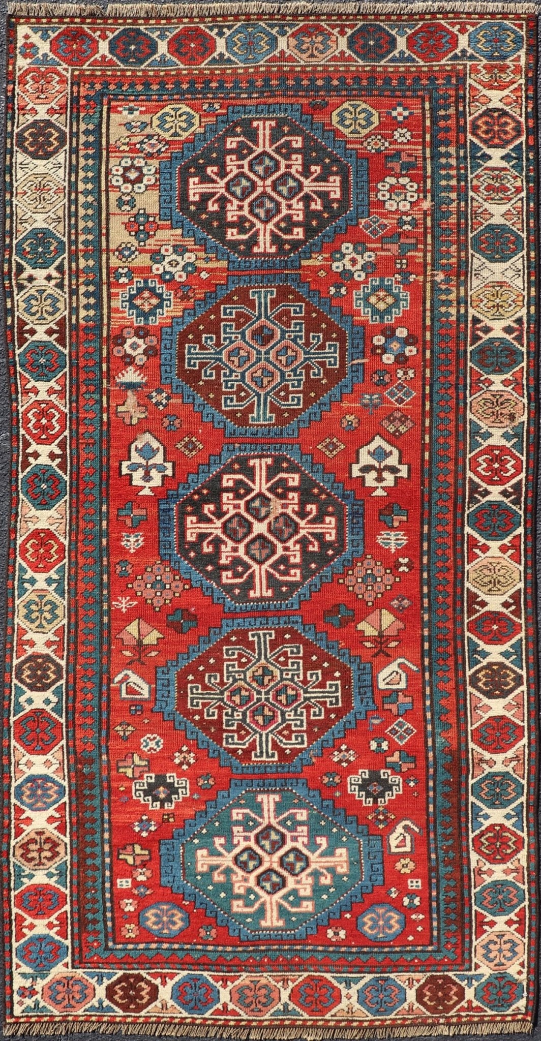 Antique Hand Knotted Caucasian Kazak Rug in Brilliant Red with Geometric Design Tribal geometric medallion design Kazak antique rug, antique Caucasian from Caucasus Region with a beautiful red background in multi - colors, Keivan Woven Arts rug V2... - Keivan Woven ArtsV21 - 0502 - 16394Rug