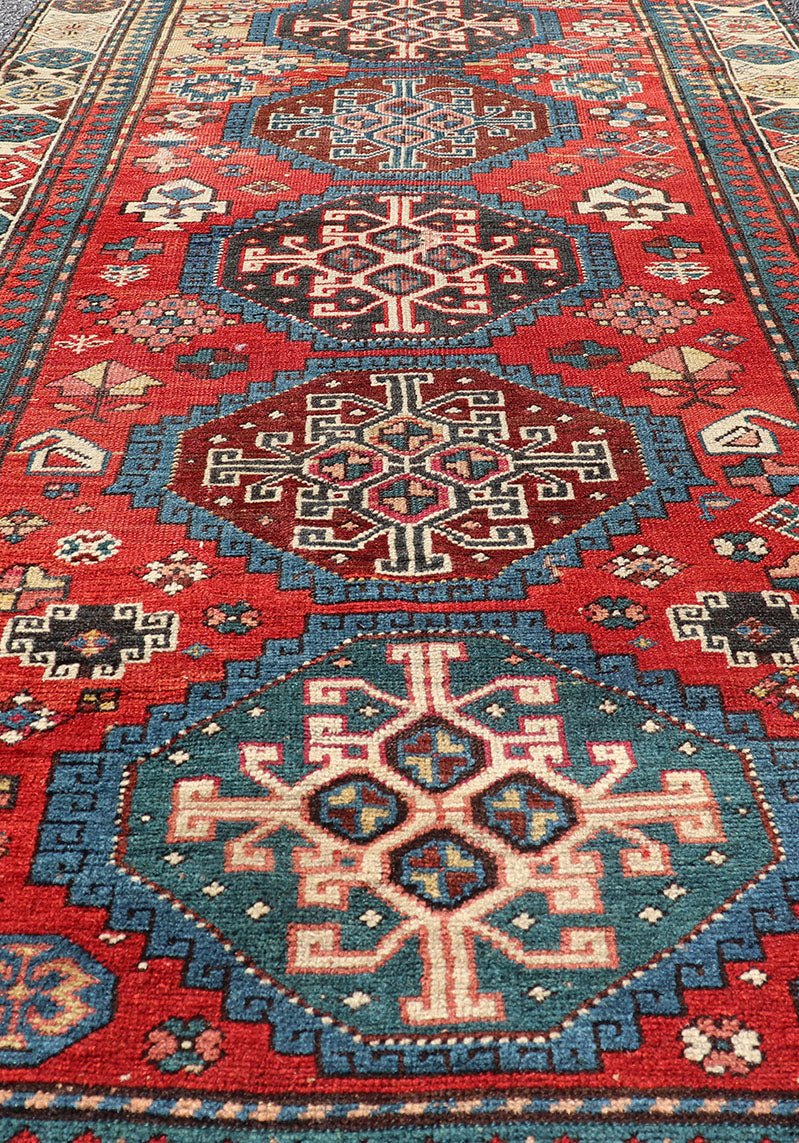 Antique Hand Knotted Caucasian Kazak Rug in Brilliant Red with Geometric Design Tribal geometric medallion design Kazak antique rug, antique Caucasian from Caucasus Region with a beautiful red background in multi - colors, Keivan Woven Arts rug V2... - Keivan Woven ArtsV21 - 0502 - 16394Rug