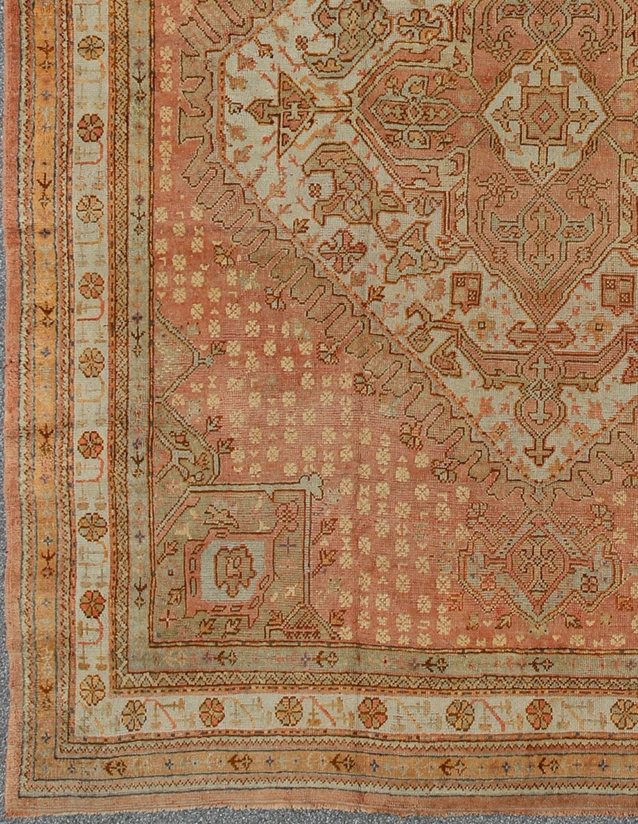Antique Turkish Oushak Rug with Geometric Medallion by Keivan Woven Arts Antique Turkish Oushak rug with geometric medallion in Salmon background. Keivan Woven Arts / VR - 7884 / country of origin / type: Turkey / Oushak, circa Early - 20th century.... - Keivan Woven ArtsVR - 7884 - 1931Rug