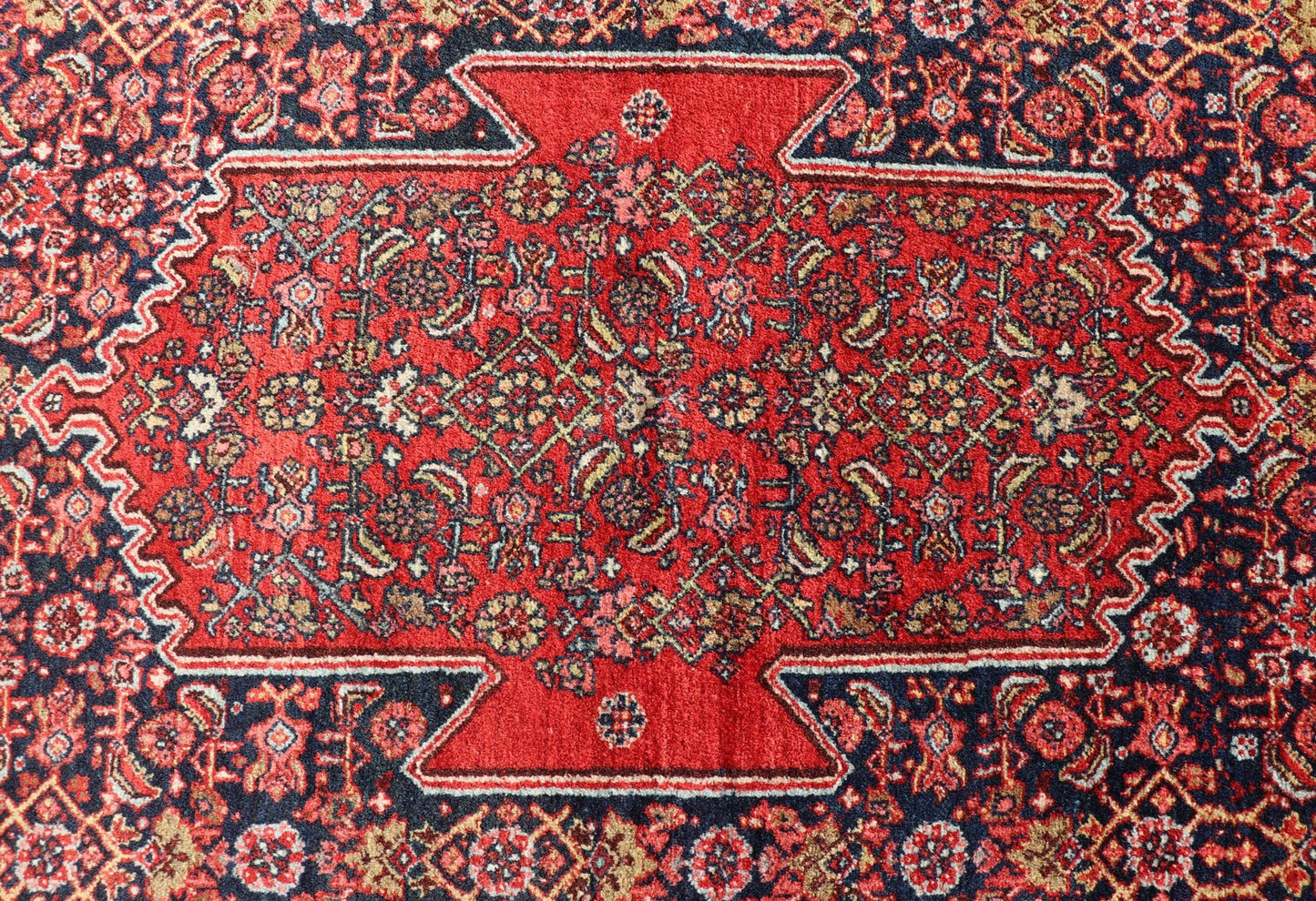 Antique Persian Bidjar Medallion Designed Carpet with of Blue's, Red, and Pink Measures: 4'5 x 6'7 The rug has a central medallion, surrounded by an intricate floral Herati design. The border utilizes softer colors of pink, blue and yel... - Keivan Woven ArtsW22 - 0102 - 18577