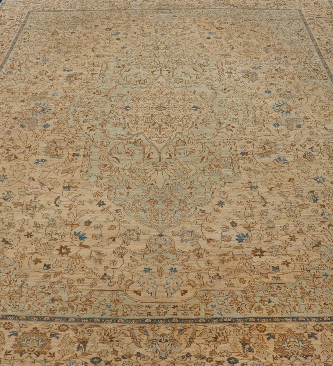 This very finely woven transitional rug, made in Turkey, is inspired by Haj Jalili Tabriz of 19th century. The light colors include cream color field and light blue highlights. Circa 1980's 9'5 x 13'5 - Keivan Woven ArtsWL - 214815 - 1193Rug