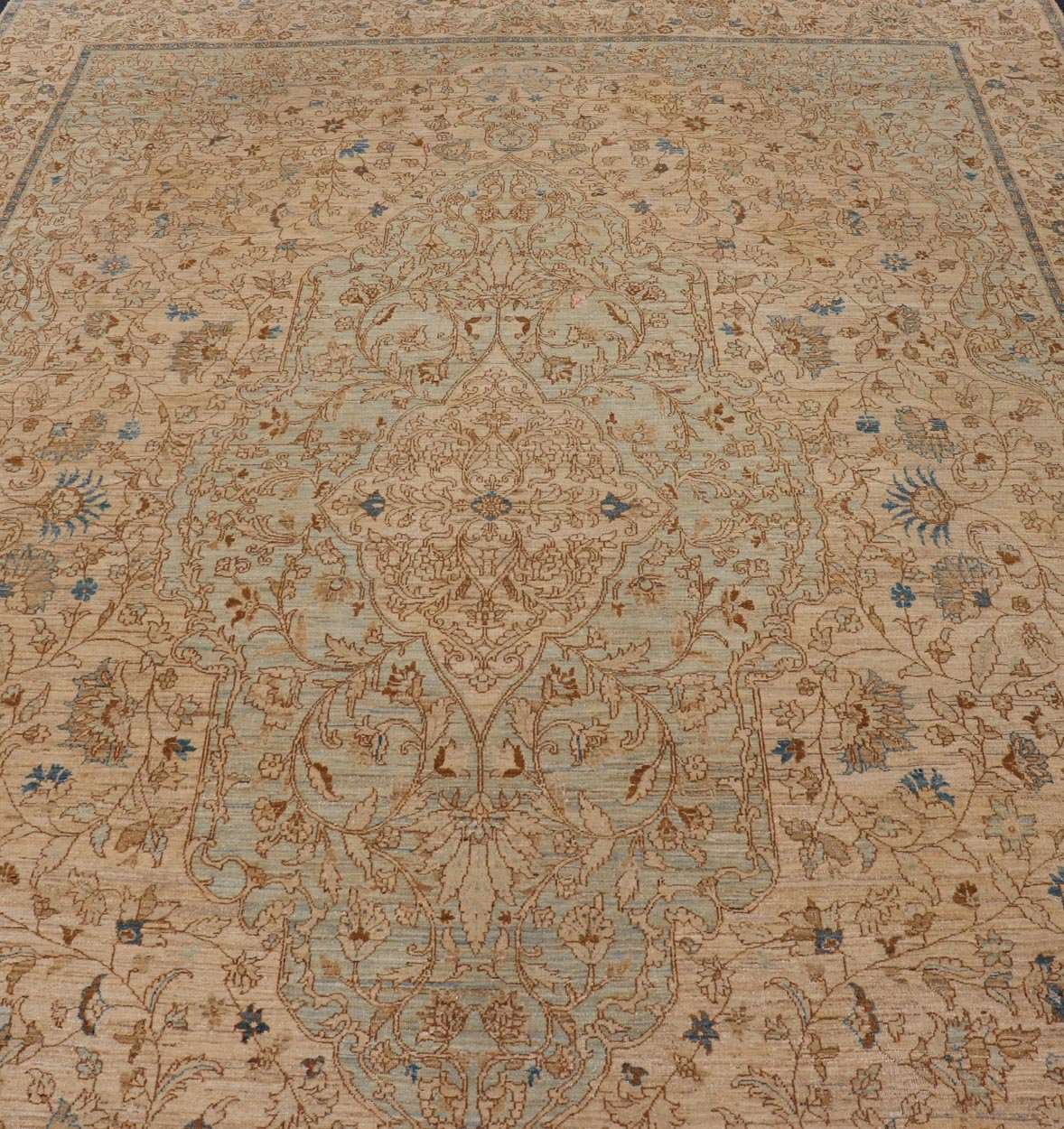 This very finely woven transitional rug, made in Turkey, is inspired by Haj Jalili Tabriz of 19th century. The light colors include cream color field and light blue highlights. Circa 1980's 9'5 x 13'5 - Keivan Woven ArtsWL - 214815 - 1193Rug