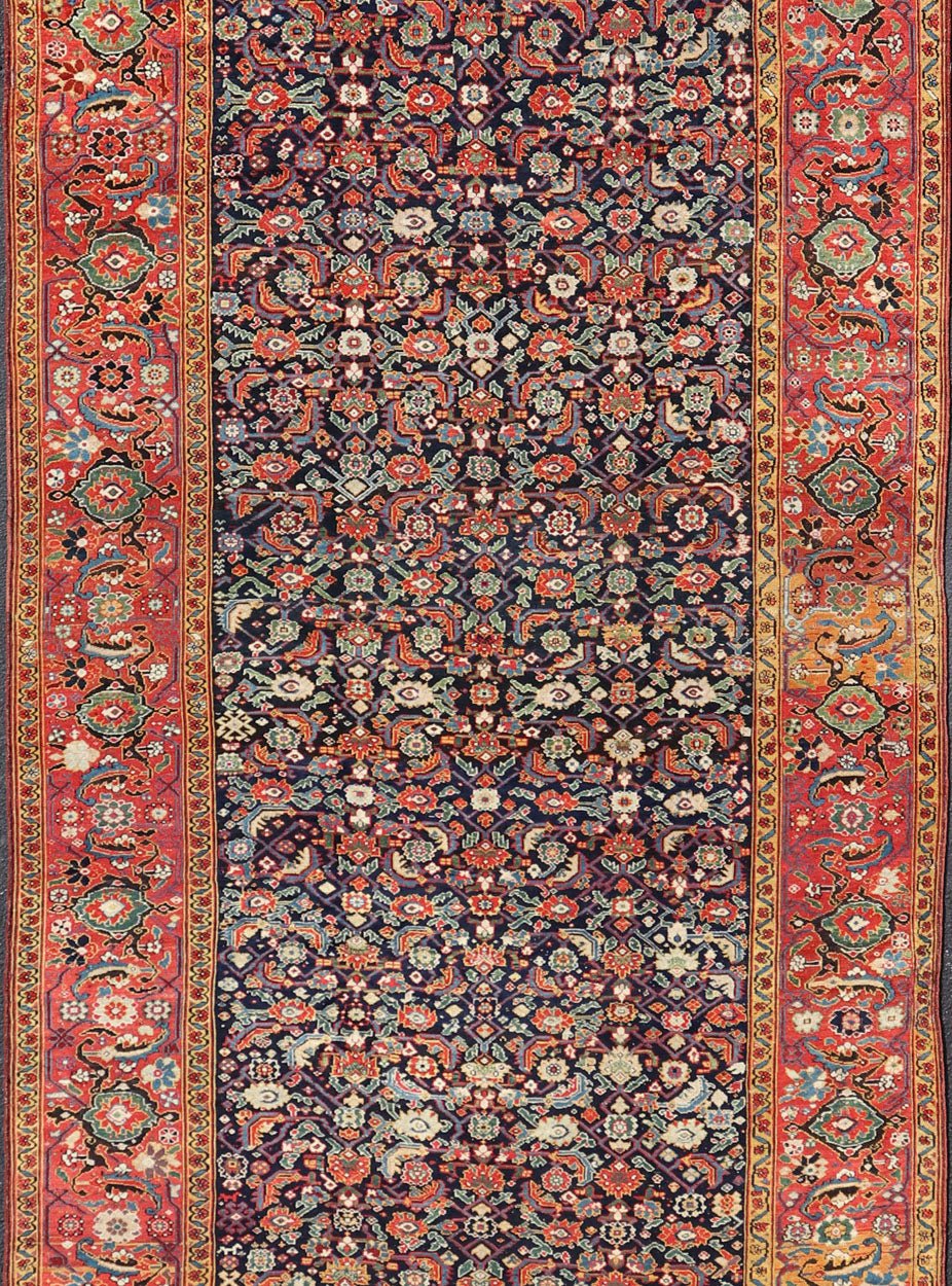 1870's Antique N.W. Persian Large Gallery Rug in Blue Background, Red Border From the estate of Jack Welch, the American Executive, this circa 1875 antique N.W. long gallery runner displays rich and brilliant array of colors set on blue backgro... - Keivan Woven ArtsX23 - 0204 - 23468