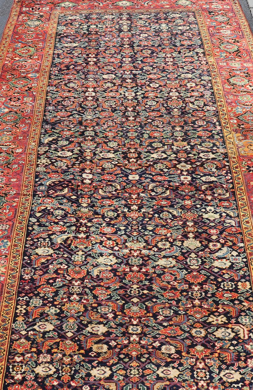 1870's Antique N.W. Persian Large Gallery Rug in Blue Background, Red Border From the estate of Jack Welch, the American Executive, this circa 1875 antique N.W. long gallery runner displays rich and brilliant array of colors set on blue backgro... - Keivan Woven ArtsX23 - 0204 - 23468