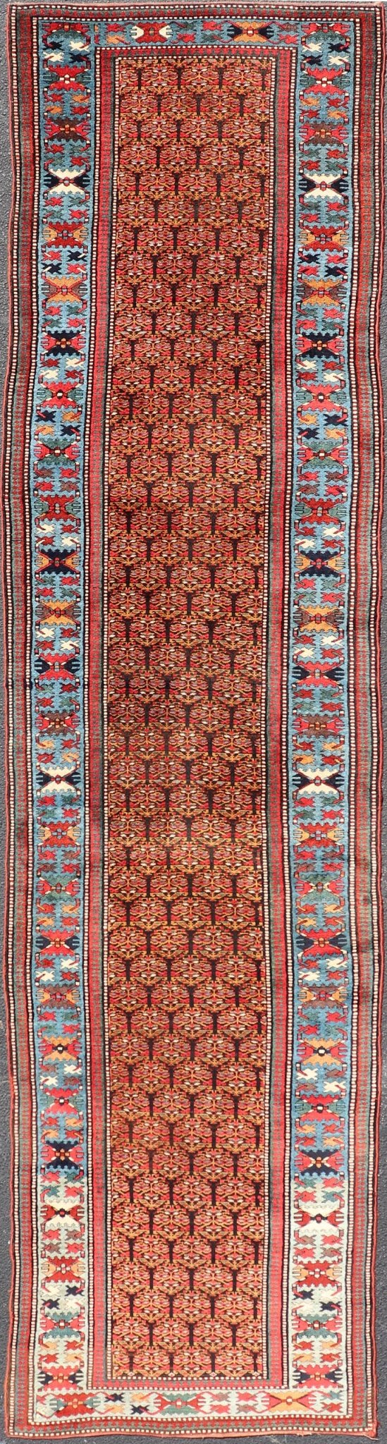 Antique Persian Kurdish Long Gallery Runner with Repeating Tribal Motif Design. Keivan Woven Arts; rug X23 - 0816 - 335; country of origin / type: Persian / Kurdish circa 1900. Measures: 3'5 x 14'9 This antique hand - knotted Persian Kurdish wide runn... - Keivan Woven ArtsX23 - 0816 - 335 - 24862Rug