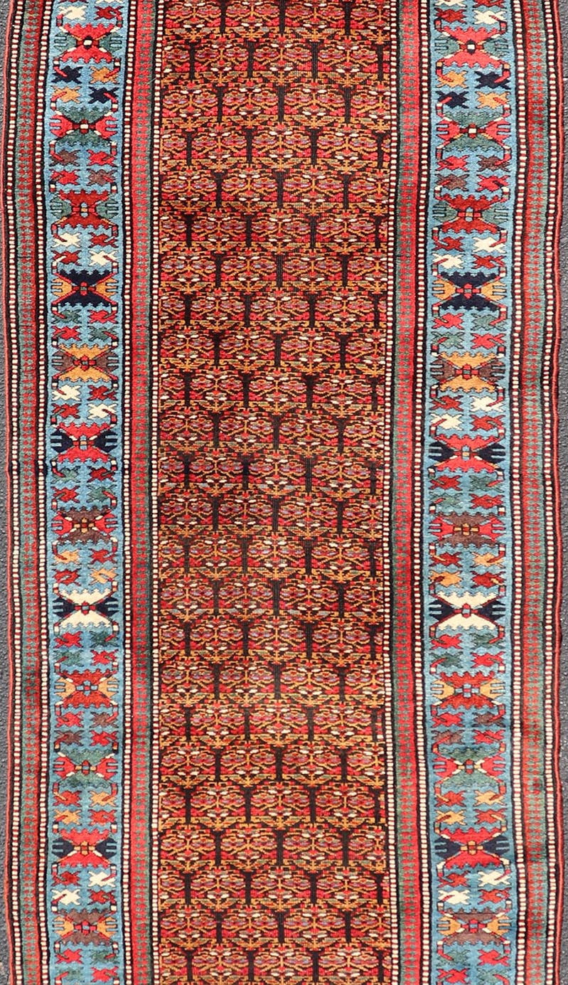 Antique Persian Kurdish Long Gallery Runner with Repeating Tribal Motif Design. Keivan Woven Arts; rug X23 - 0816 - 335; country of origin / type: Persian / Kurdish circa 1900. Measures: 3'5 x 14'9 This antique hand - knotted Persian Kurdish wide runn... - Keivan Woven ArtsX23 - 0816 - 335 - 24862Rug