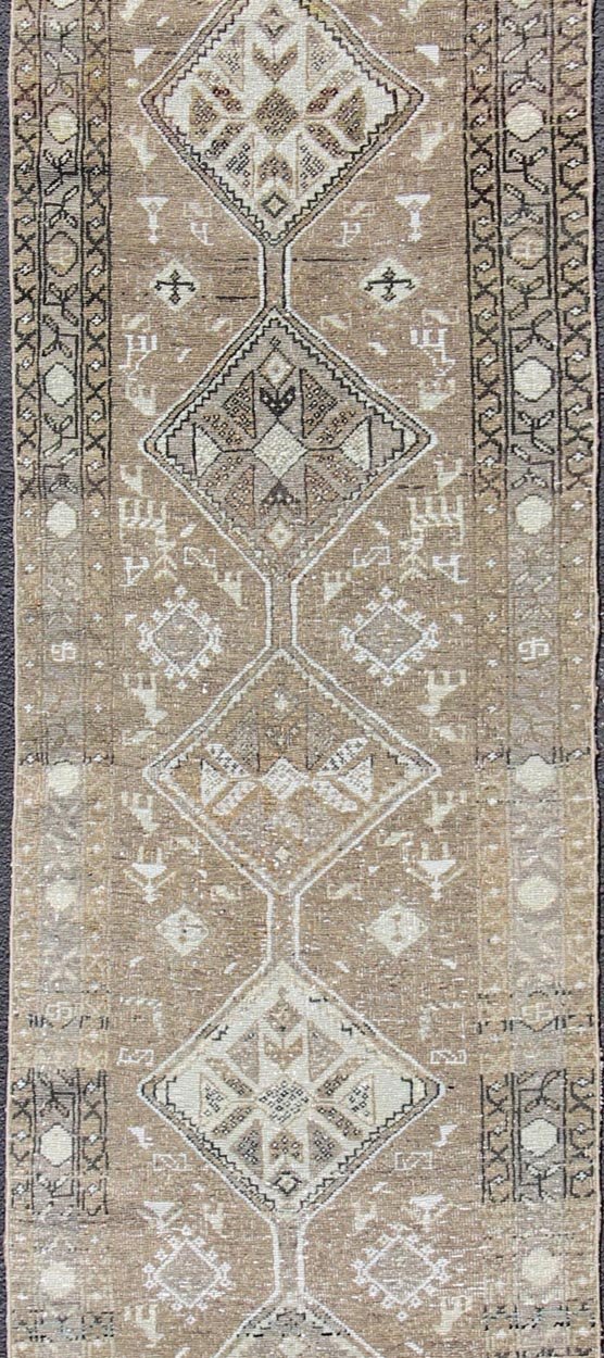 Tribal diamond medallion antique Heriz runner Persian in taupe, camel, brown, rug zir - 20, country of origin / type: Iran / Heriz, circa 1910 This antique Persian Heriz gallery rug, circa early 20th century, features a unique blend of colors and ... - Keivan Woven ArtsZIR - 20 - 10090Rug