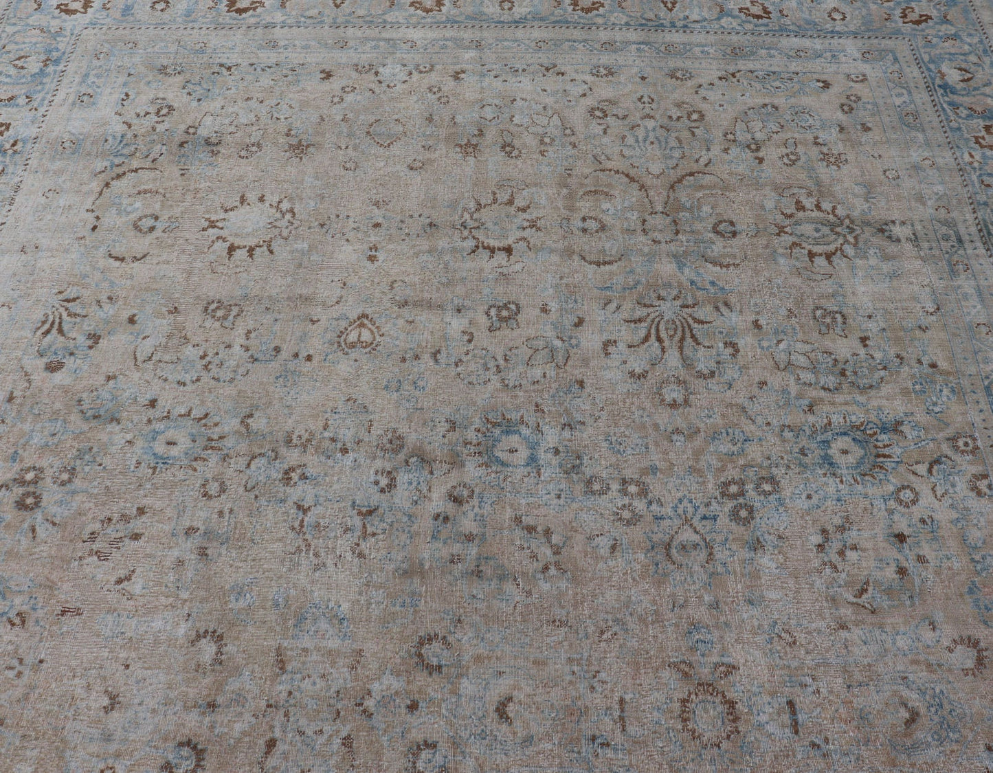 Persian distressed Antique Mashhad Carpet with Muted Floral and Medallion Design. Antique distressed Persian Mashhad carpet with tan and blue floral and medallion design, / ZIR - 51 - KV - 10. Persian Mashhad floral design. This outstanding mu... - Keivan Woven ArtsZIR - 51 - KV - 10 - 14994