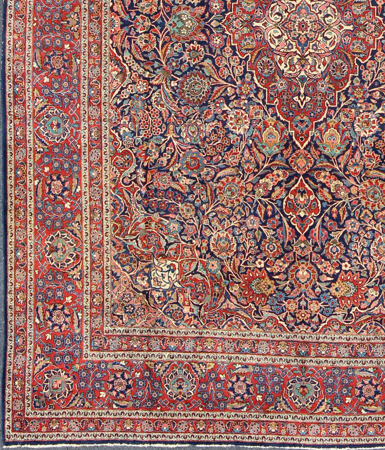 Fine Kashan Red and blue antique Persian Manchester Kashan rug with Arabesque blossom design, rug 11 - 90401, country of origin / type: Iran / Kashan, circa 1910 Gorgeous antique rug (circa 1910). Madder red and indigo blue set the attractive col... - Keivan Woven Arts11 - 90401 - 207Rug