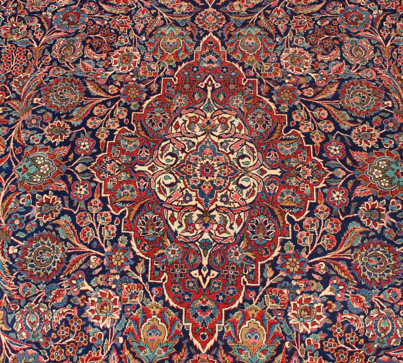 Fine Kashan Red and blue antique Persian Manchester Kashan rug with Arabesque blossom design, rug 11 - 90401, country of origin / type: Iran / Kashan, circa 1910 Gorgeous antique rug (circa 1910). Madder red and indigo blue set the attractive col... - Keivan Woven Arts11 - 90401 - 207Rug