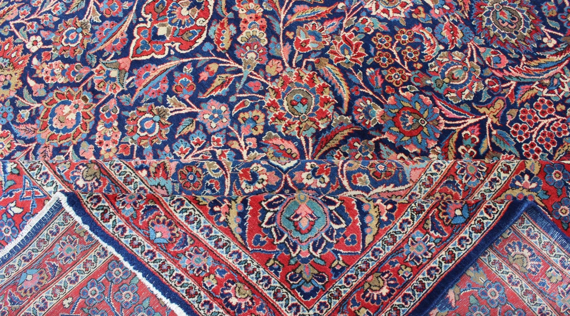 Fine Kashan Red and blue antique Persian Manchester Kashan rug with Arabesque blossom design, rug 11 - 90401, country of origin / type: Iran / Kashan, circa 1910 Gorgeous antique rug (circa 1910). Madder red and indigo blue set the attractive col... - Keivan Woven Arts11 - 90401 - 207Rug