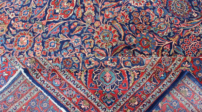 Fine Kashan Red and blue antique Persian Manchester Kashan rug with Arabesque blossom design, rug 11 - 90401, country of origin / type: Iran / Kashan, circa 1910 Gorgeous antique rug (circa 1910). Madder red and indigo blue set the attractive col... - Keivan Woven Arts11 - 90401 - 207Rug