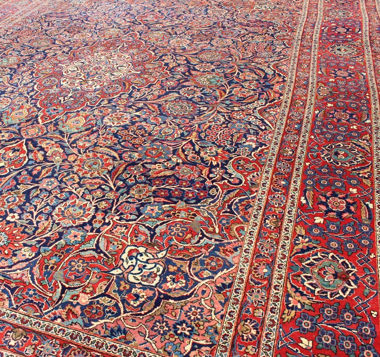 Fine Kashan Red and blue antique Persian Manchester Kashan rug with Arabesque blossom design, rug 11 - 90401, country of origin / type: Iran / Kashan, circa 1910 Gorgeous antique rug (circa 1910). Madder red and indigo blue set the attractive col... - Keivan Woven Arts11 - 90401 - 207Rug