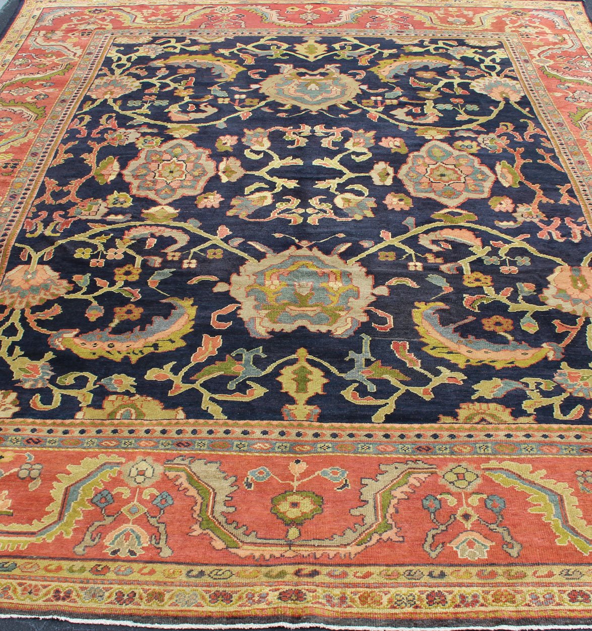 Amazing antique Persian Sultanabad carpet in navy blue background, yellow, citron green and rose red with large scale flowers. Keivan Woven Arts / 13 - 0511 / country of origin / type: Iran / Sultanabad, circa 1880. 19th century Sultanabad. Navy antique ... - Keivan Woven Arts13 - 0511 - 4226Rug