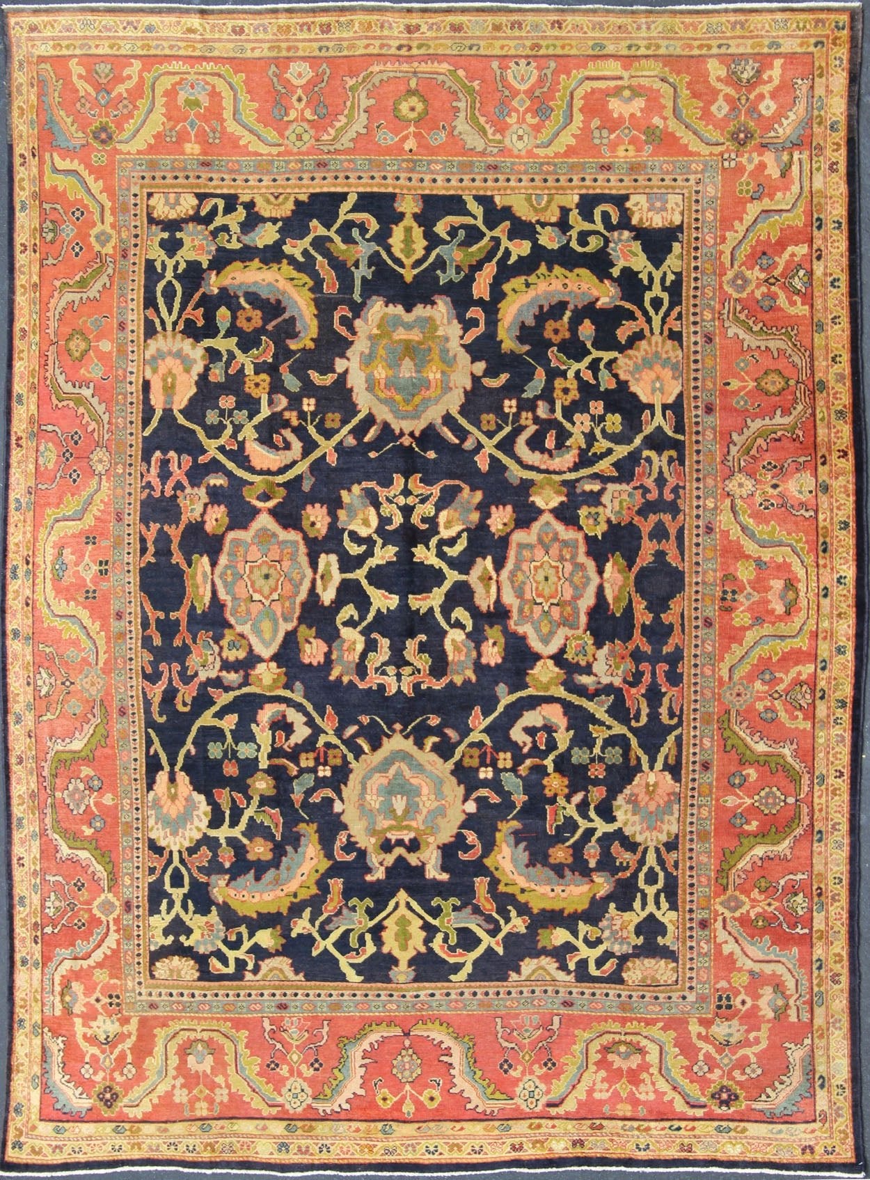 Amazing antique Persian Sultanabad carpet in navy blue background, yellow, citron green and rose red with large scale flowers. Keivan Woven Arts / 13 - 0511 / country of origin / type: Iran / Sultanabad, circa 1880. 19th century Sultanabad. Navy antique ... - Keivan Woven Arts13 - 0511 - 4226Rug