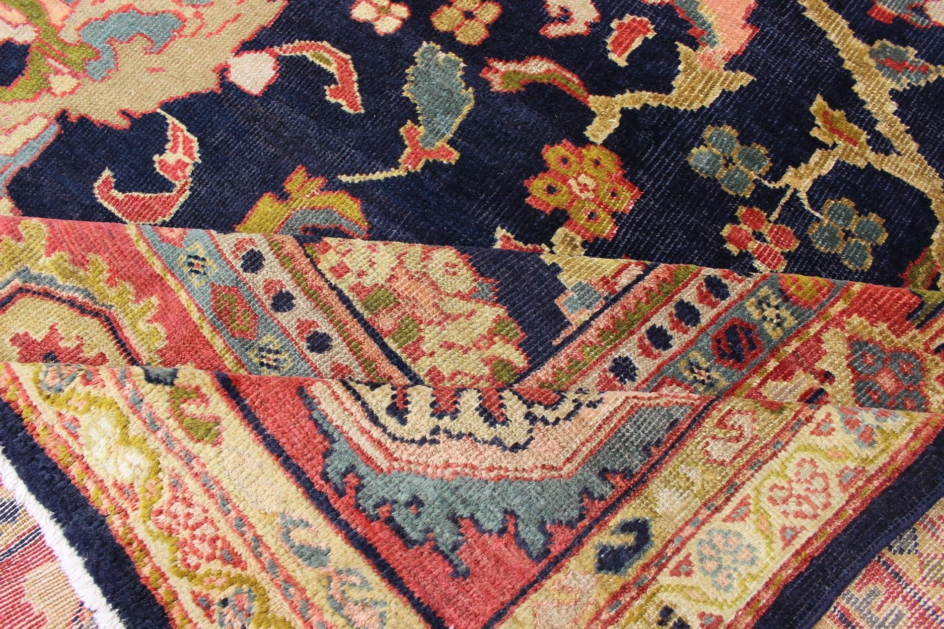 Amazing antique Persian Sultanabad carpet in navy blue background, yellow, citron green and rose red with large scale flowers. Keivan Woven Arts / 13 - 0511 / country of origin / type: Iran / Sultanabad, circa 1880. 19th century Sultanabad. Navy antique ... - Keivan Woven Arts13 - 0511 - 4226Rug