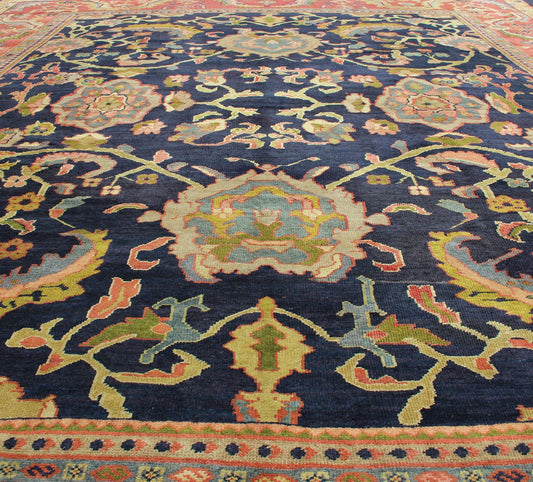 Amazing antique Persian Sultanabad carpet in navy blue background, yellow, citron green and rose red with large scale flowers. Keivan Woven Arts / 13 - 0511 / country of origin / type: Iran / Sultanabad, circa 1880. 19th century Sultanabad. Navy antique ... - Keivan Woven Arts13 - 0511 - 4226Rug