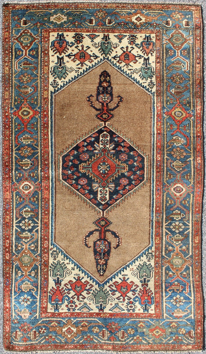 Antique Persian Serab rug with stretched tribal medallion in camel, blue, ivory and red, rug m14 - 0506, country of origin / type: Iran / Serab, circa 1900 This early 20th century, handwoven antique Persian Serab rug features a camel - colored field... - Keivan Woven Arts13 - 0906 - 4790Rug