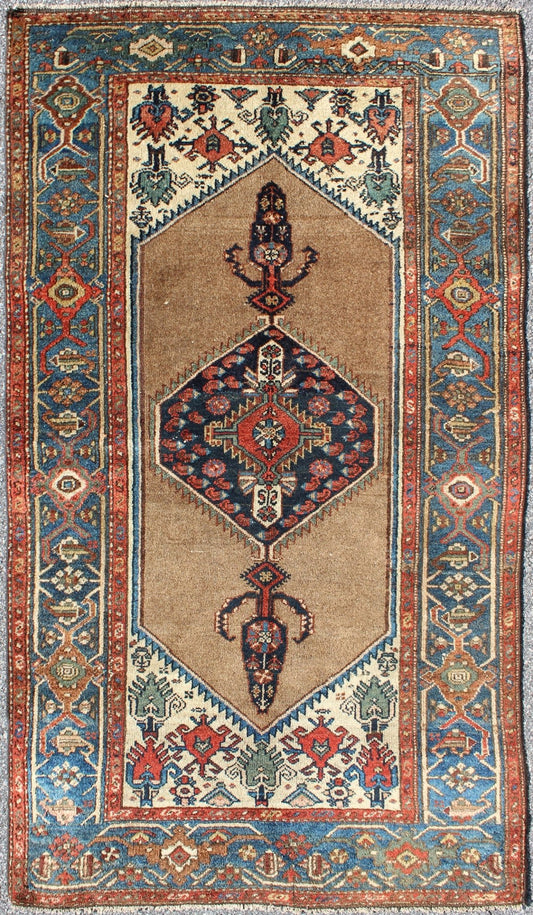 Antique Persian Serab rug with stretched tribal medallion in camel, blue, ivory and red, rug m14 - 0506, country of origin / type: Iran / Serab, circa 1900 This early 20th century, handwoven antique Persian Serab rug features a camel - colored field... - Keivan Woven Arts13 - 0906 - 4790Rug