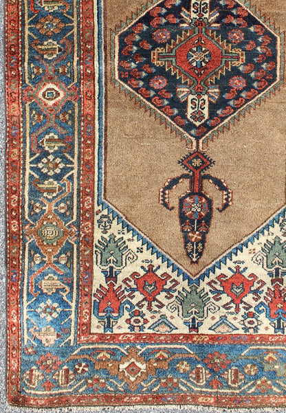 Antique Persian Serab rug with stretched tribal medallion in camel, blue, ivory and red, rug m14 - 0506, country of origin / type: Iran / Serab, circa 1900 This early 20th century, handwoven antique Persian Serab rug features a camel - colored field... - Keivan Woven Arts13 - 0906 - 4790Rug