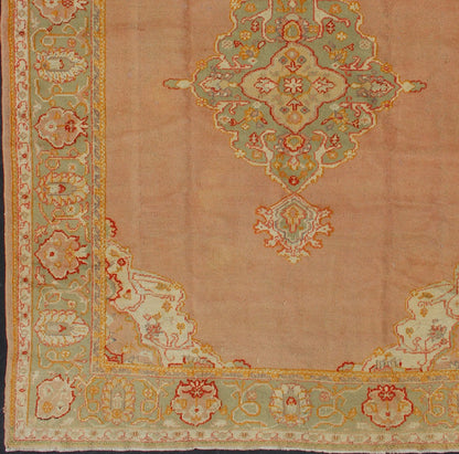Keivan Woven Arts, kwarugs / 13 - 1004 Antique Turkish Oushak in Pink and Light Green Antique Turkish Oushak This antique Oushak from the early part of 20th Century bears a stylized medallion that commands the center field. Coral and light pink in... - Keivan Woven Arts13 - 1004 - 5154Rug