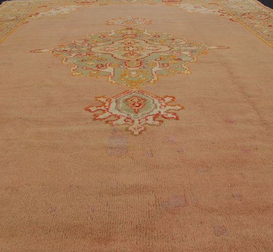 Keivan Woven Arts, kwarugs / 13 - 1004 Antique Turkish Oushak in Pink and Light Green Antique Turkish Oushak This antique Oushak from the early part of 20th Century bears a stylized medallion that commands the center field. Coral and light pink in... - Keivan Woven Arts13 - 1004 - 5154Rug