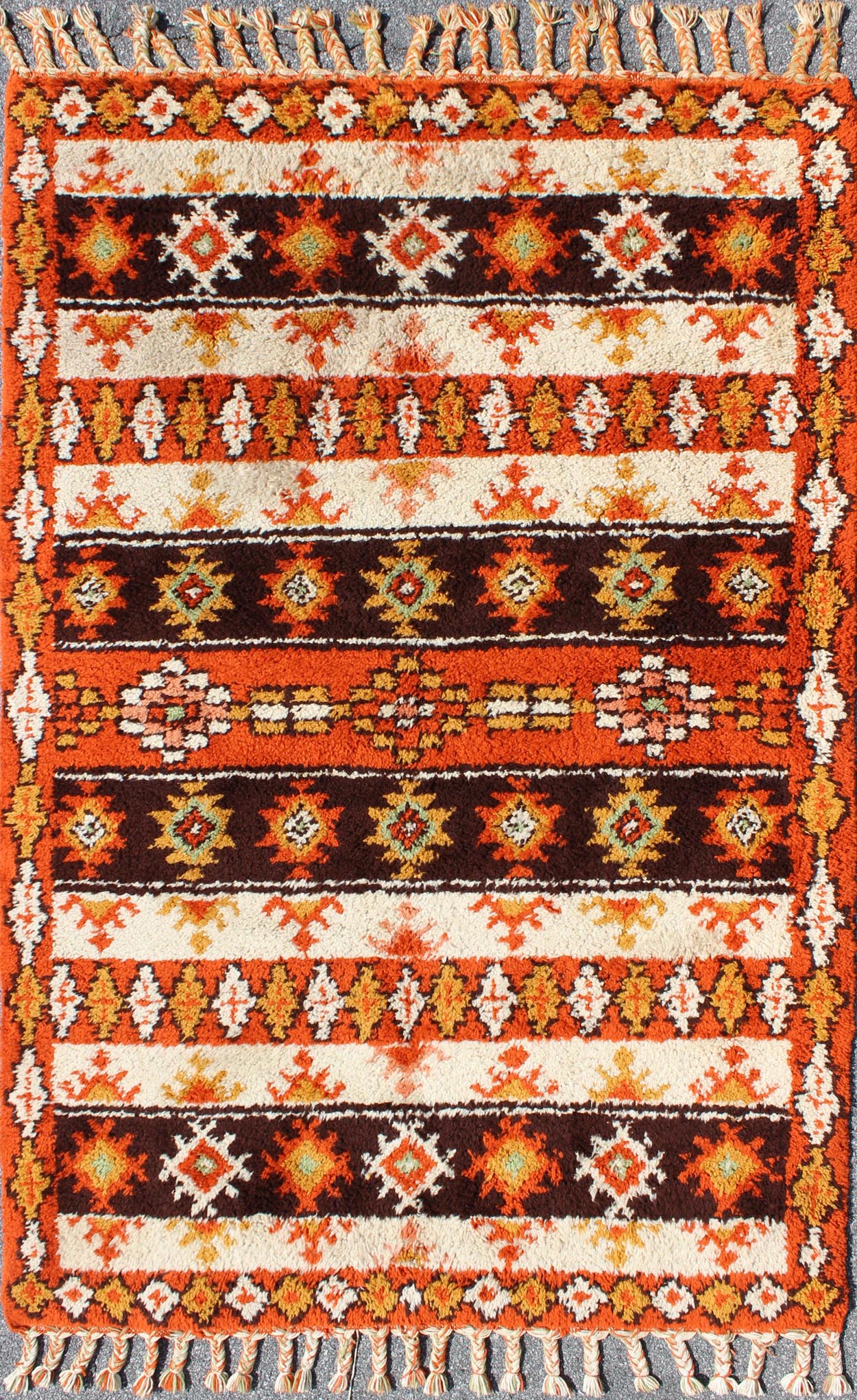 Vintage Moroccan Rug with Stripes & Tribal Design in Orange, D. Brown, Ivory Vintage Moroccan Berber Rug, rug 13 - 1202, country of origin / type: Morocco / Tribal, circa Late - 20th Century. Measures: 6' x 9'. This colorful Vintage Mo... - Keivan Woven Arts13 - 1202 - 5197Rug