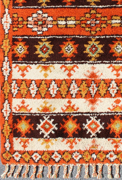Vintage Moroccan Rug with Stripes & Tribal Design in Orange, D. Brown, Ivory Vintage Moroccan Berber Rug, rug 13 - 1202, country of origin / type: Morocco / Tribal, circa Late - 20th Century. Measures: 6' x 9'. This colorful Vintage Mo... - Keivan Woven Arts13 - 1202 - 5197Rug