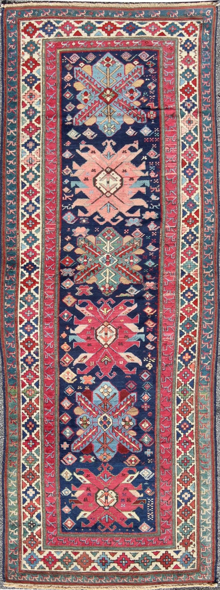 Antique Late 19th Century Kazak Caucasian Runner in Navy Blue Background. Keivan Woven Arts / rug 16 - 0603, country of origin / type: Caucus / Caucasian, circa 1890. Antique Geometric Caucasian Kazak. Measures: 3'6 x 9'9. This antique Caucasian r... - Keivan Woven Arts16 - 0603 - 7419Rug